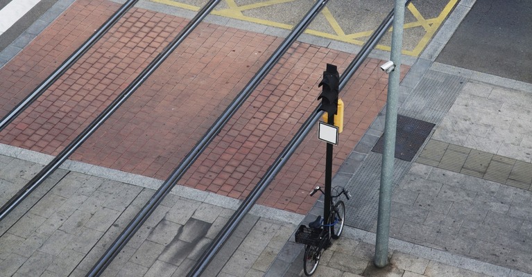 view of a road and tram junction with bicycle